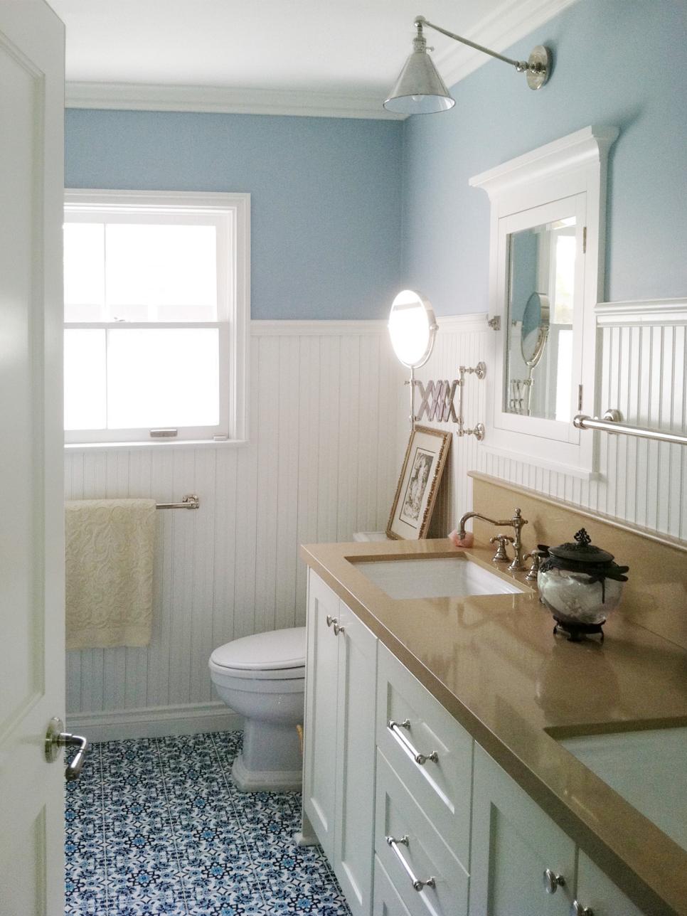 Blue and White Bathroom With White Wainscoting 