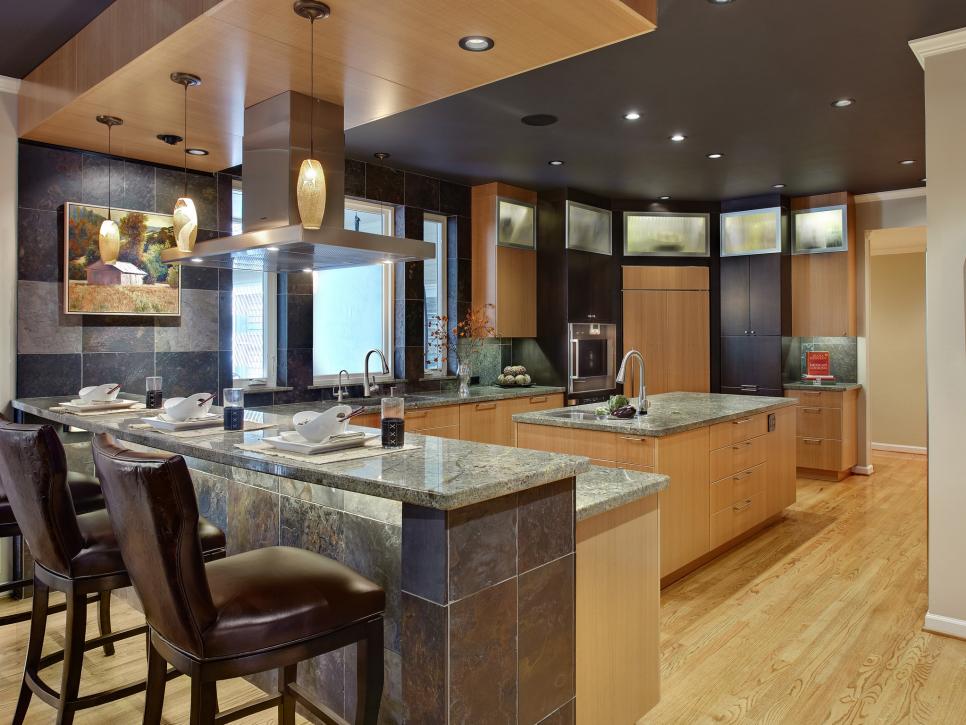 Contemporary Kitchen With Large Island and Slate Walls
