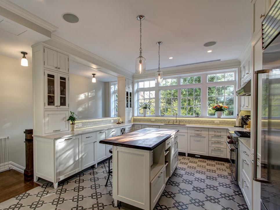 Transitional Kitchen With Geometric Tile Floor and White Cabinets