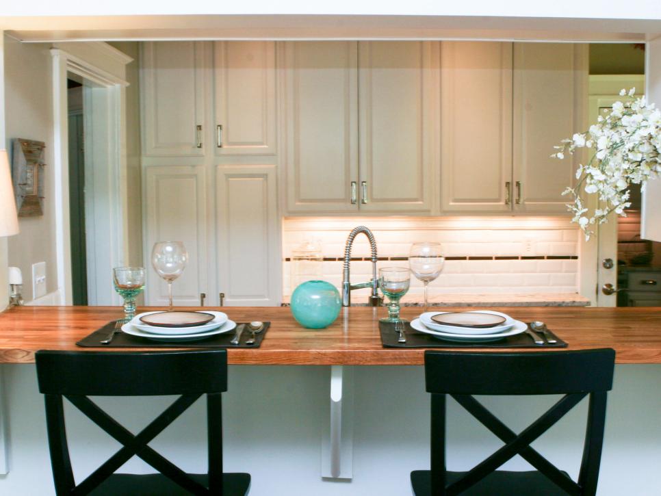 White Transitional Kitchen With Black Bar Stools
