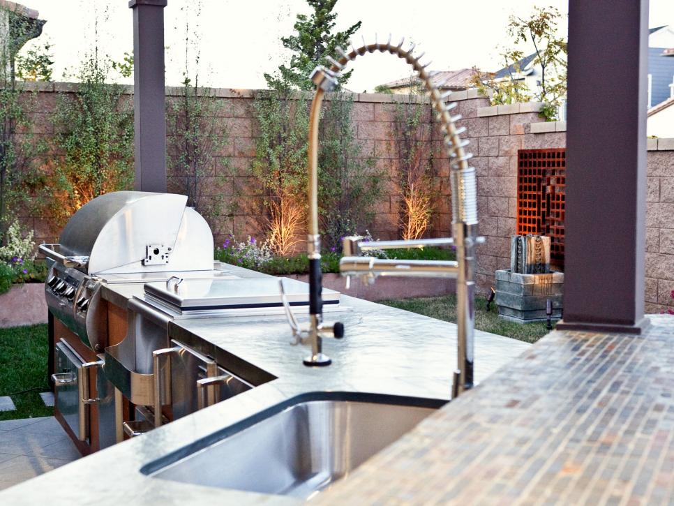 Outdoor Kitchen with Stainless Grill and Mosaic Tile Bar