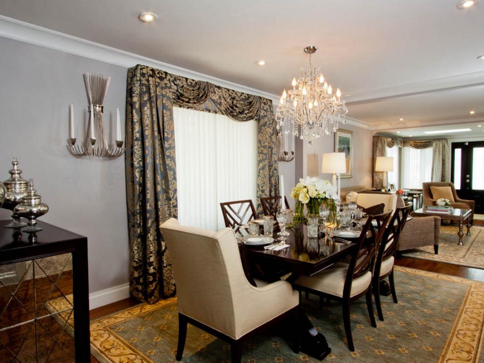 Transitional Dining Room With Upholstered Chairs and Chandelier