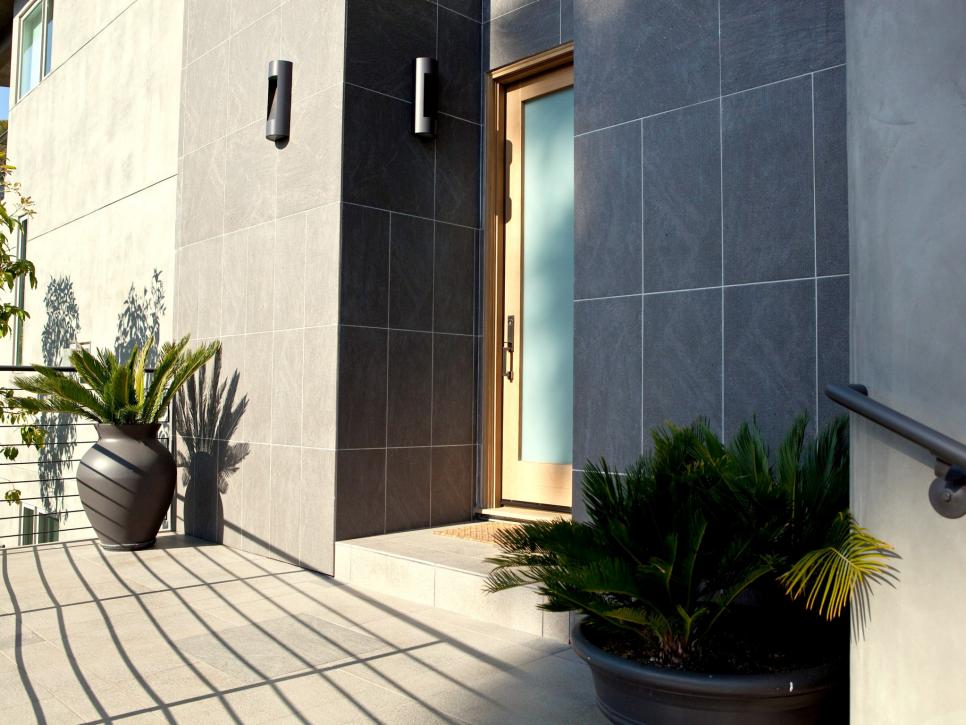 Front Exterior With Gray Tile and Plant Vases