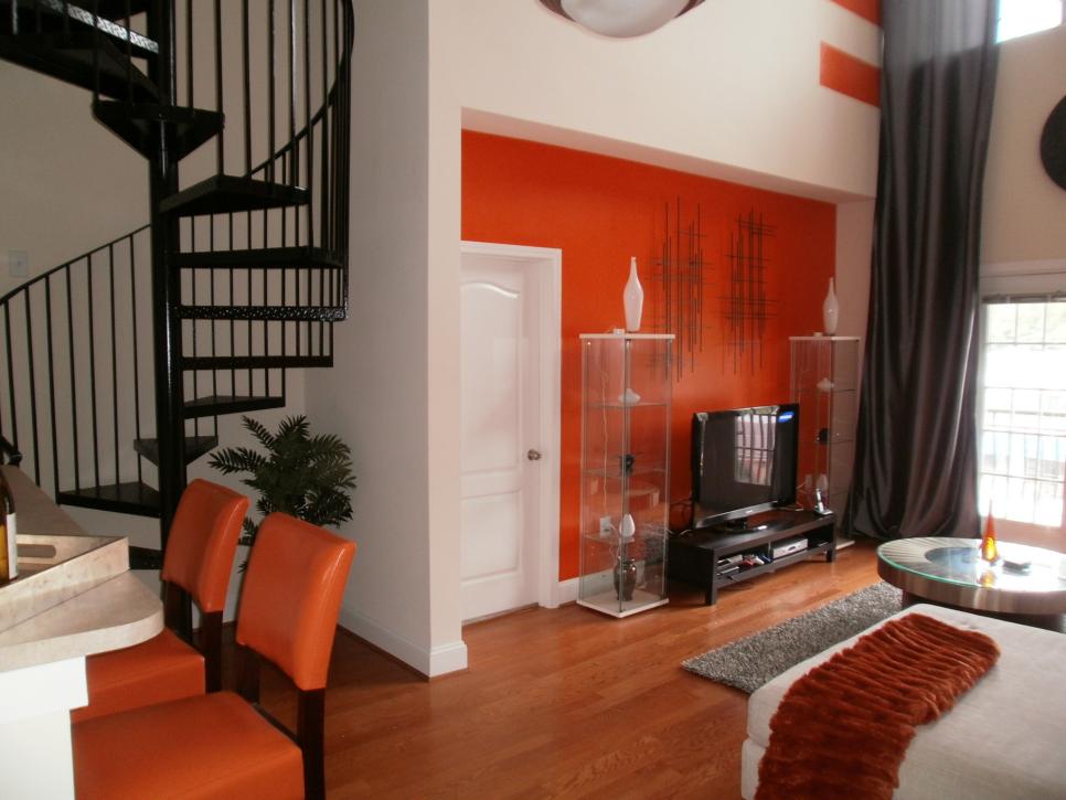 Orange and White Family Room With Spiral Staircase