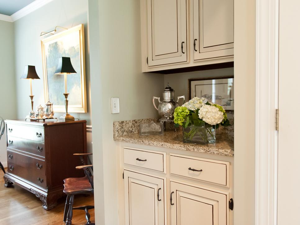Butler's Pantry With Distressed White Cabinets for Storage
