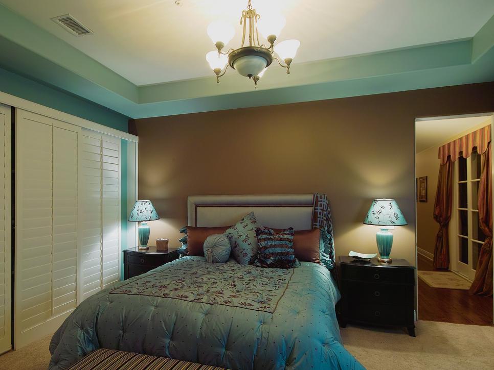 Brown and Blue Bedroom With Bed and Lamps