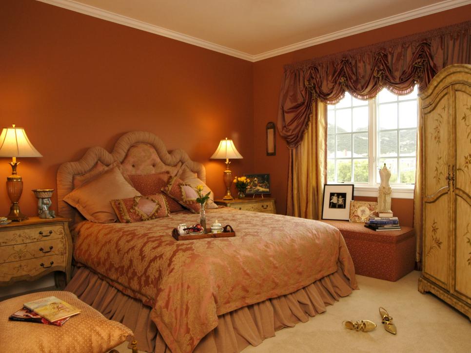 Pumpkin-Colored Bedroom with Painted Armoire and Bedside Tables