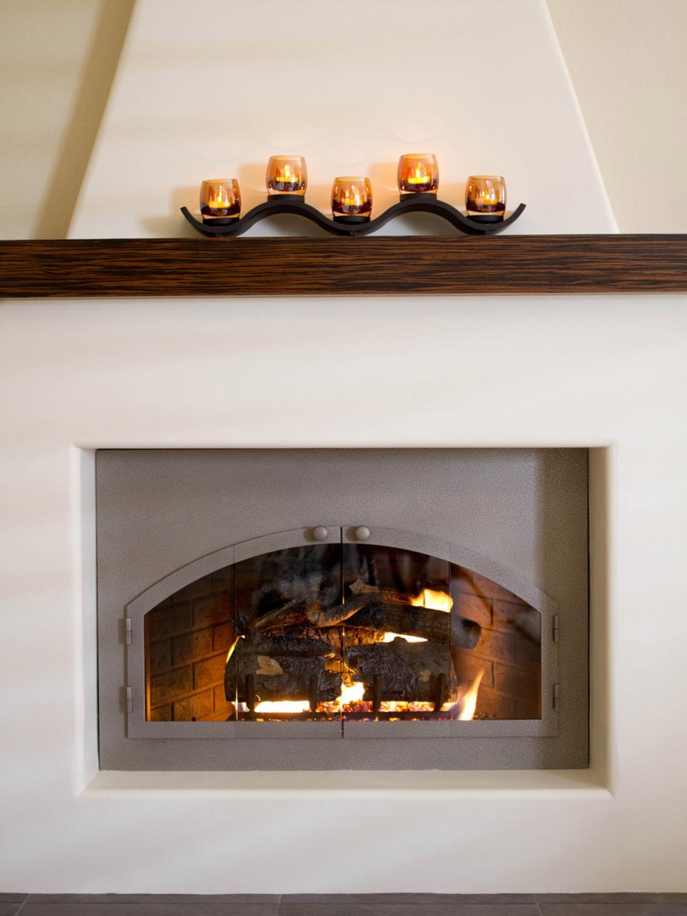 White Adobe Fireplace With Gas Logs and Wood Mantel
