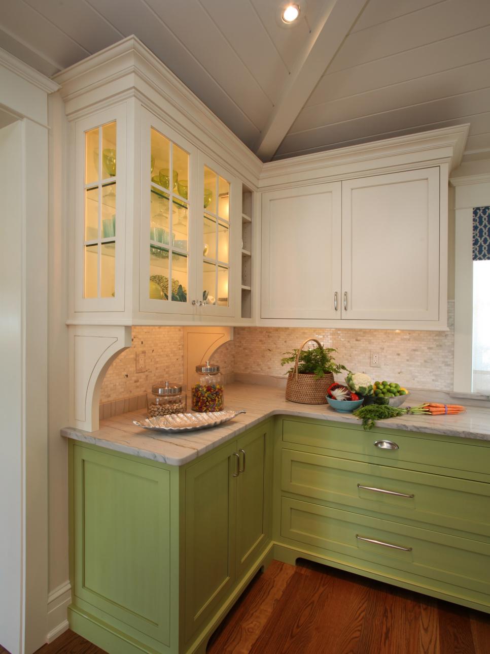 Kitchen With Colored Cabinetry and Hardwood Floor
