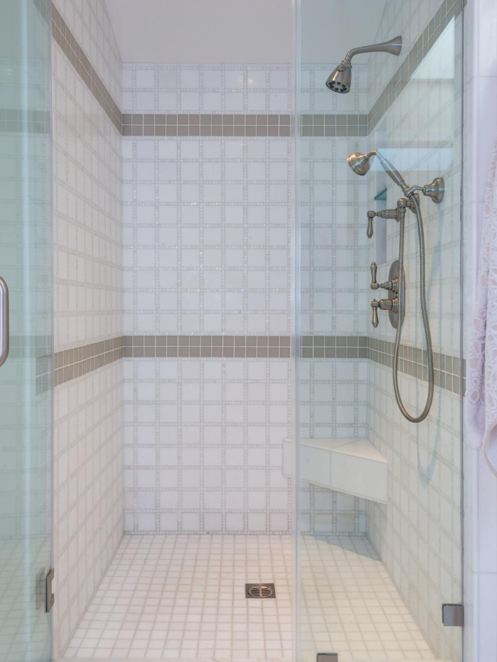 White Walk-In Spa-Style Shower with Gray Tile Stripes