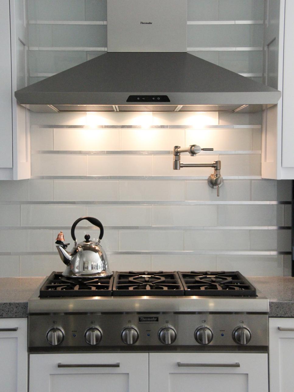 Contemporary White Backsplash With Stainless Steel Range