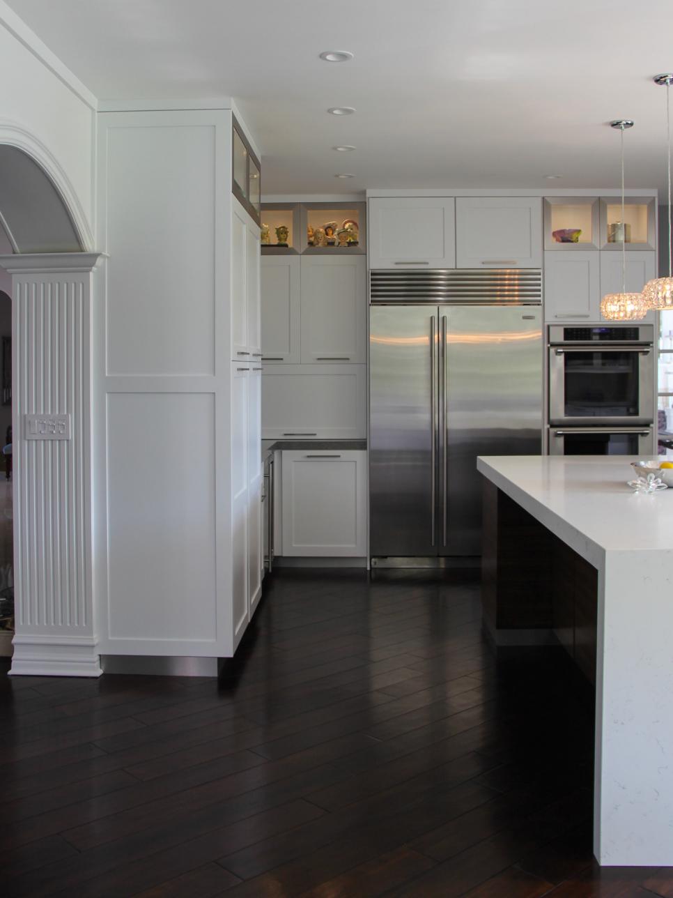 Floor-to-Ceiling White Cabinets Against Dark Hardwood Floors