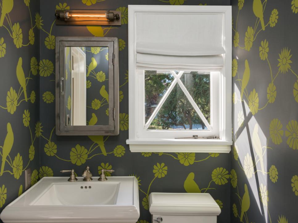 Small Bathroom With Green and Gray Wallpaper and White Sink