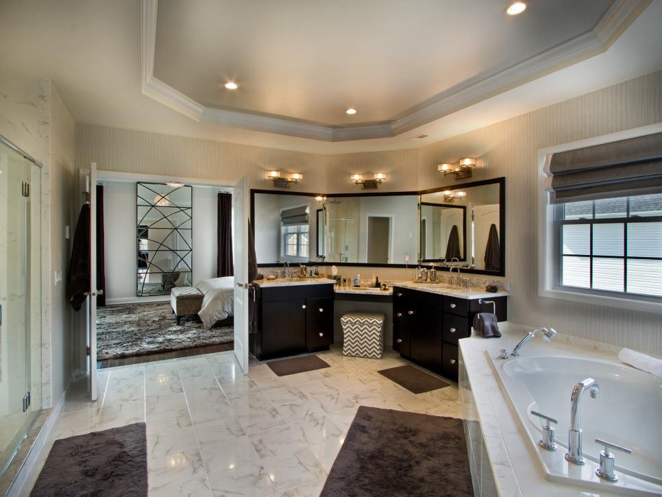 Spacious Neutral Bathroom With Tray Ceiling and Marble Floors