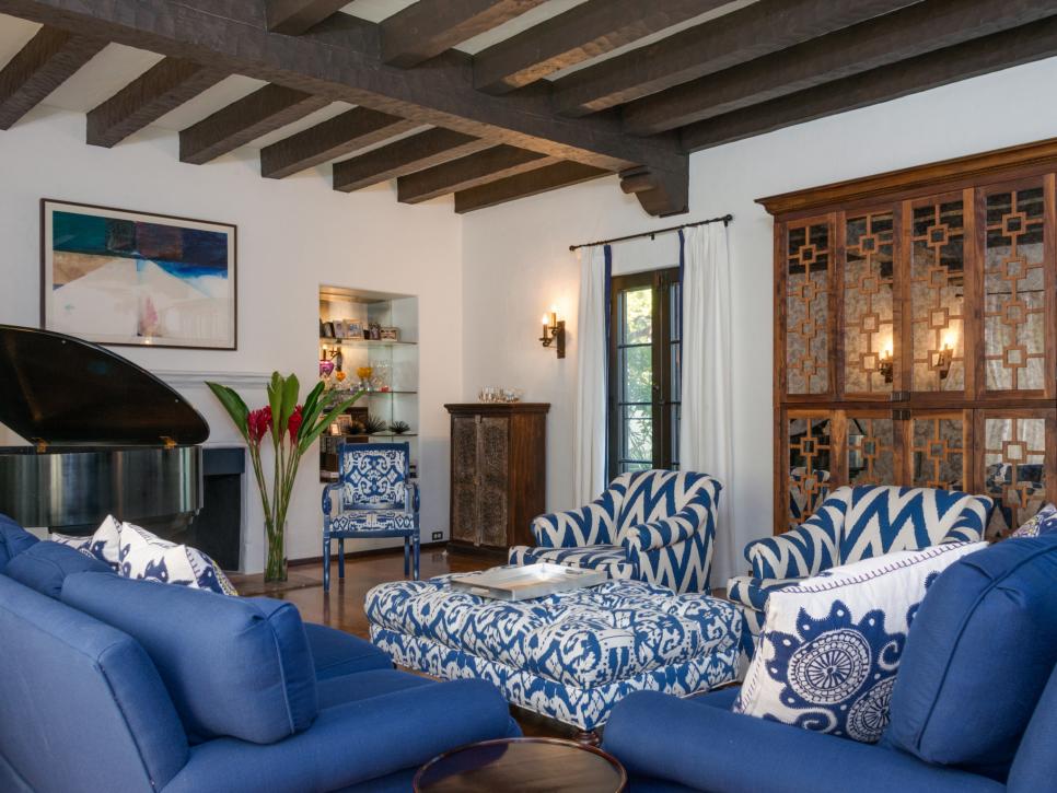 Transitional Living Room With Blue Patterned Seating and Ottoman
