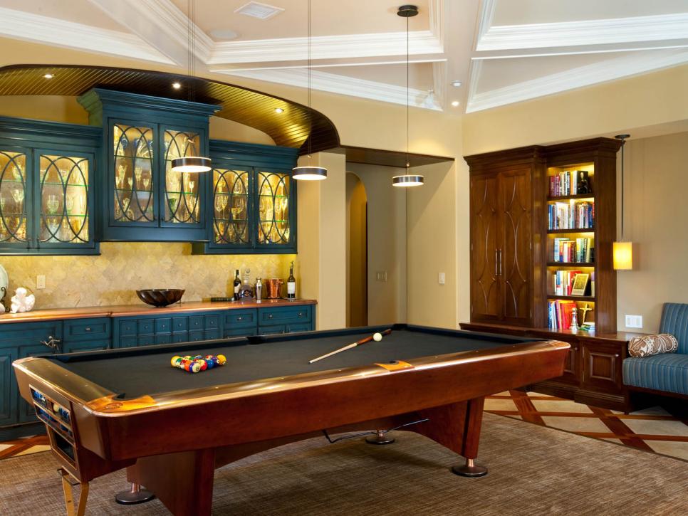 Billiard Room With Blue Cabinets and Back-Lit Bookshelf