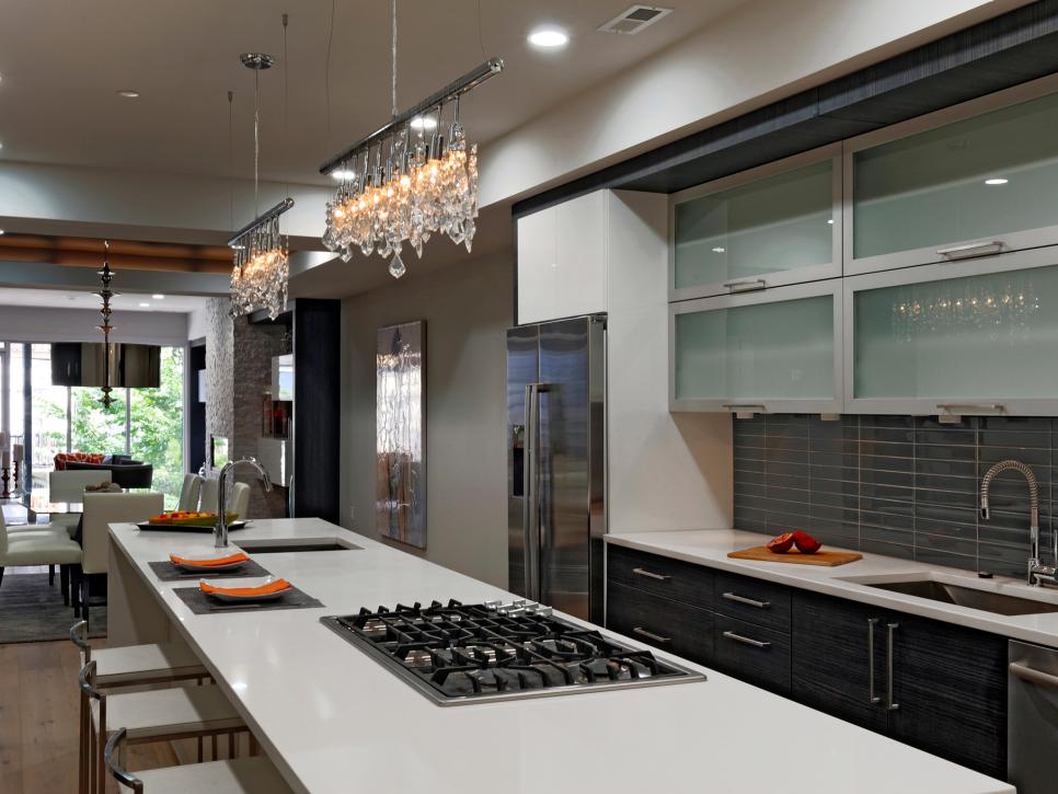 Modern Kitchen With Long Island and Crystal Track Lights