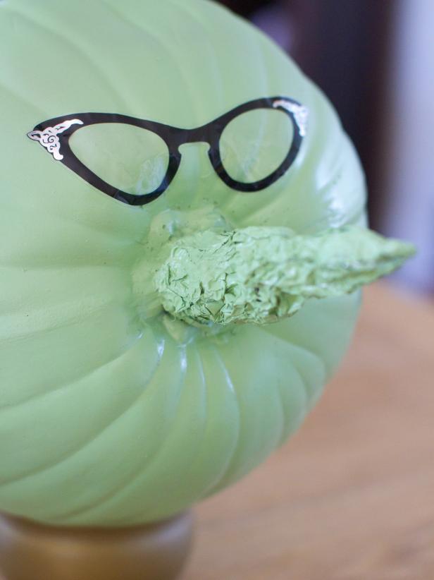 Attach eyeglasses sticker above the tin foil nose.