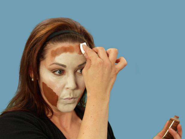 For enviable Halloween cat makeup, get the perfect base by using a makeup sponge to apply foundation that is several times lighter than your skin to the nose, middle of the forehead, under the eyes, along the cheeks and down the chin. Use a different makeup sponge and apply dark orange-brown foundation to all the areas not covered by the light foundation. Use a third sponge and lightly blend where the two colors meet. Use black eyeliner to fill in the brows. Add sharper angles over the middle of the eyes to create a dramatic peak. Heavily line the bottom lash line and extend the line out past the eye. Inside, extend the line a little down the inside of the nose. Line the top lash line and on the inside corner of the eye. Extend the top line to meet the bottom line. With the pencil, cover the eyelid, extending out beyond the eye. Blend the lines with a small, flat makeup brush to make them smooth.