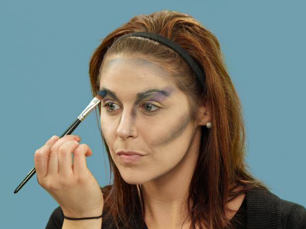 Finish it off with a swipe of blue eye shadow just under the eyebrow.