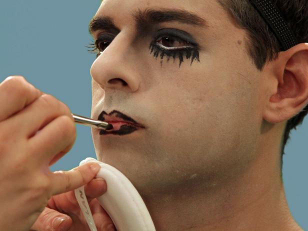 Start on the outside of the lips and fill in about 2/3 of the way. Use a flat brush to blend the eyeliner.