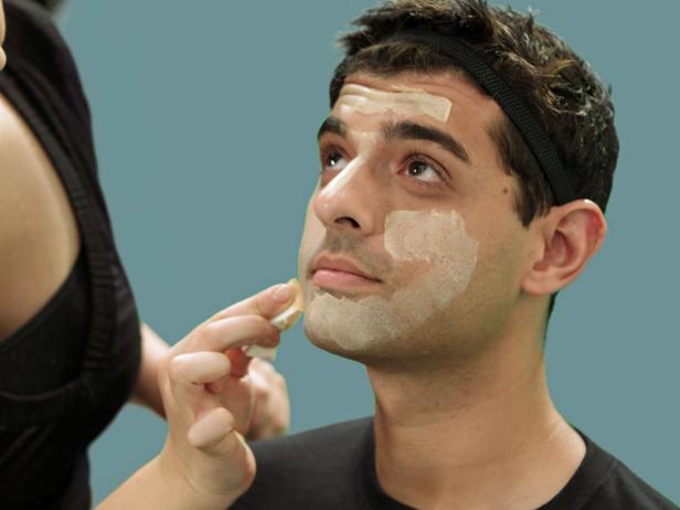 Begin with a clean face and add moisturizer. Let it dry completely. This allows the makeup to blend evenly and stay fresh-looking longer. Next, use a makeup sponge to apply a foundation that's several shades lighter than your natural skin tone.