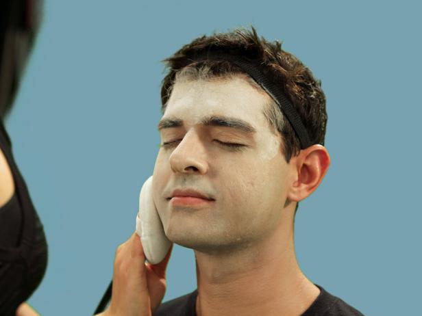 Apply foundation all over the face and down the neck. Thoroughly blend for a pasty, gothic look. Set with loose translucent powder to keep foundation in place. Dust off any excess powder.