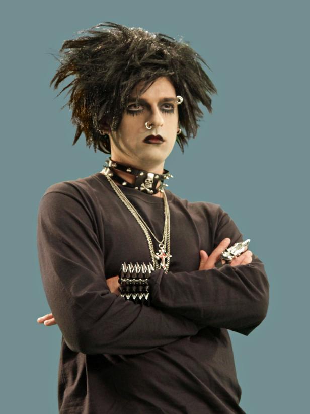 Add some rocker accessories, including a wig, dog collar or studded chocker necklace, cross necklaces and a skull finger sleeve ring to complete the rocker look.