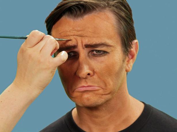 Add wrinkles from the long days in the sun by using the brush to make crease lines between the eyebrows, in the nasal folds and a few on the forehead.