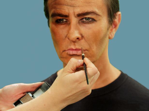 Pucker the lips and add some dark shadow to the lines that exist naturally.