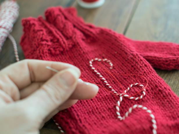 Where twine for monogram needs to loop, allow it to overlap and stitch both sections of twine together to mitten.