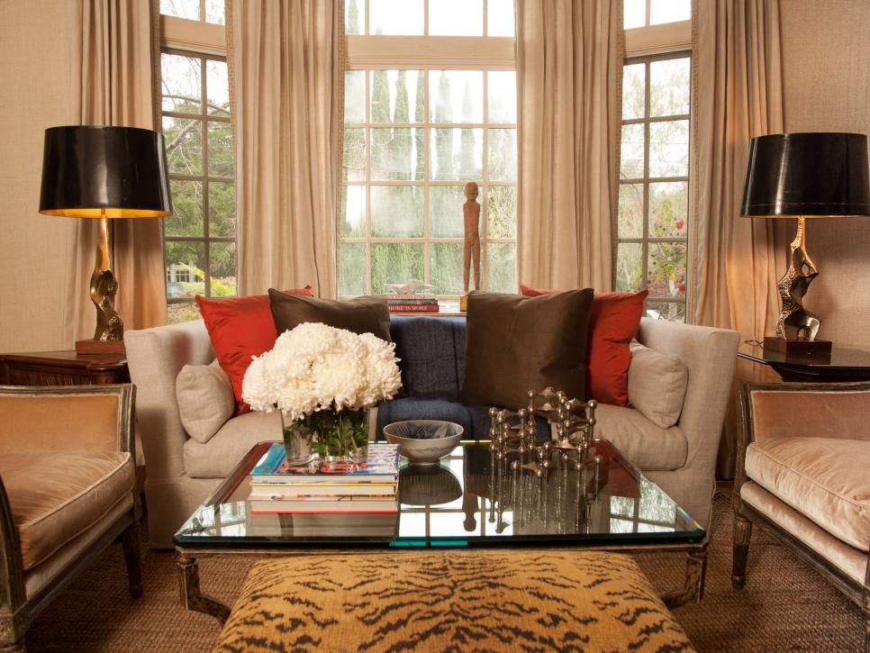 Neutral Sitting Room With Bay Window Behind Linen Sofa With Pillows