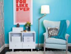 Blue Room With Wingback Chair and White Side Table