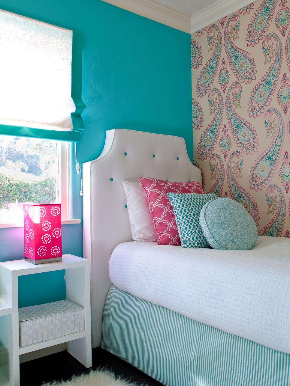 Bedroom With Aqua Walls and a White Headboard