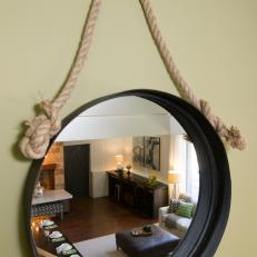 Round Hanging Mirror Reflecting Great Room