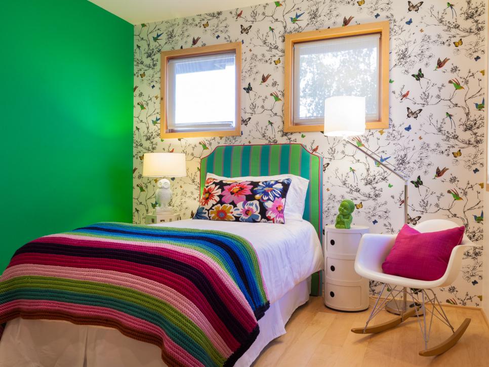 Colorful Girl's Bedroom With Wallpaper Accent Wall and Eames Rocker