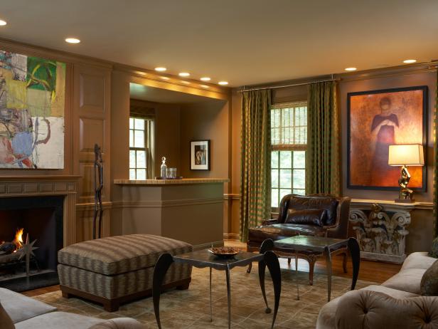 Traditional brown living room with bar area, fireplace & abstract art