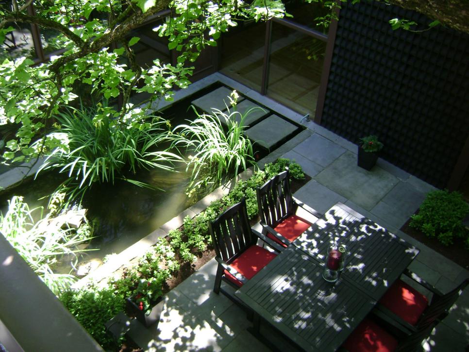 Aerial View of Stone Patio With Rectangular Pond & Dining Table