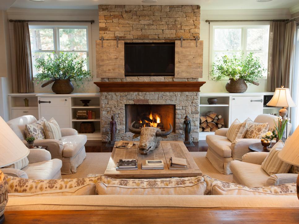 Neutral Transitional Living Room's Rustic Accents and Stone Fireplace