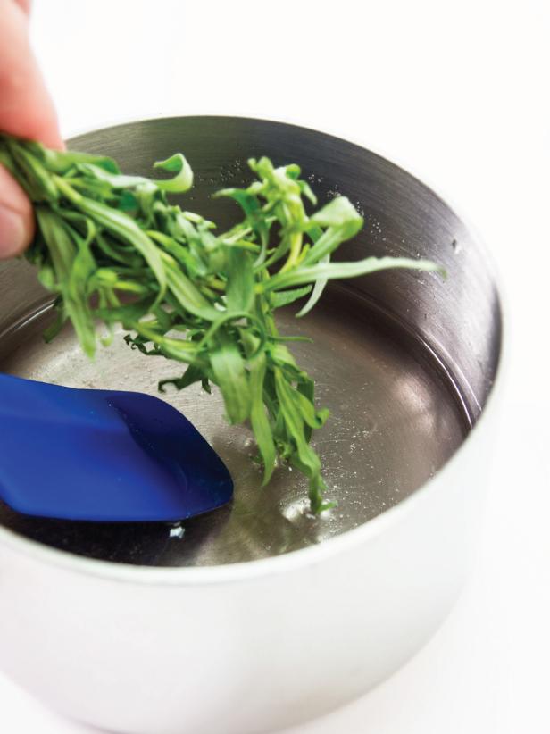 Placing Bunch of Tarragon Into Metal Pot