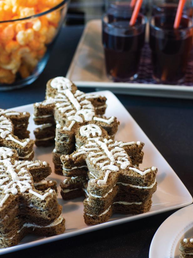 Final step: cover in plastic wrap and chill long enough for the cream cheese to become firm before serving. Leave their bones shaking and their tummies full with these delicious scream cheese sandwiches.