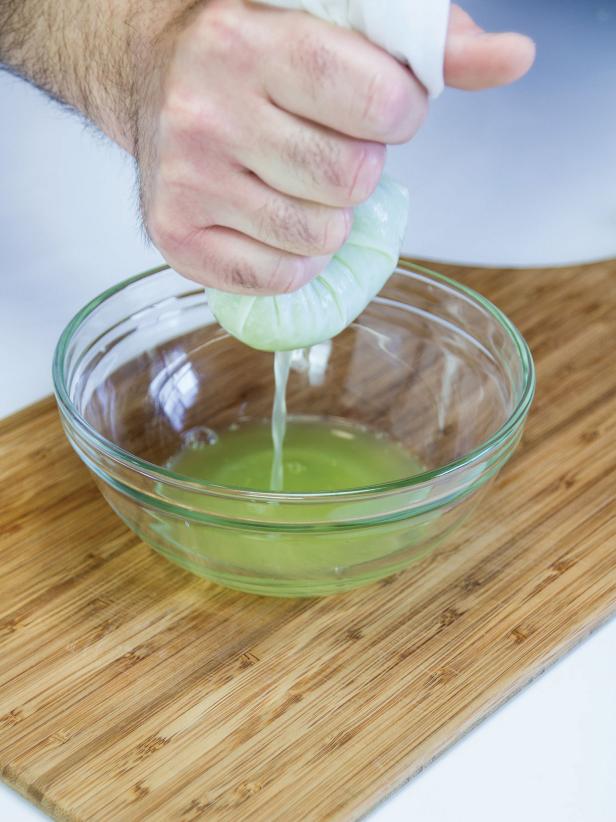 Place the grated cucumber in a bowl lined with a cheesecloth, squeeze to expel as much of the liquid from the cucumber pulp as possible.