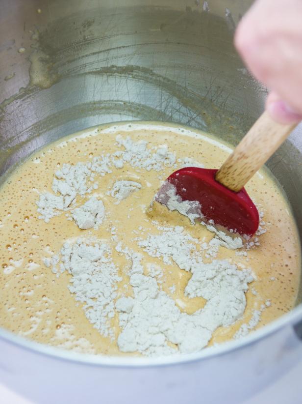 Using a spoon or rubber spatula, add the flour in thirds, folding after each addition just until flour is moistened