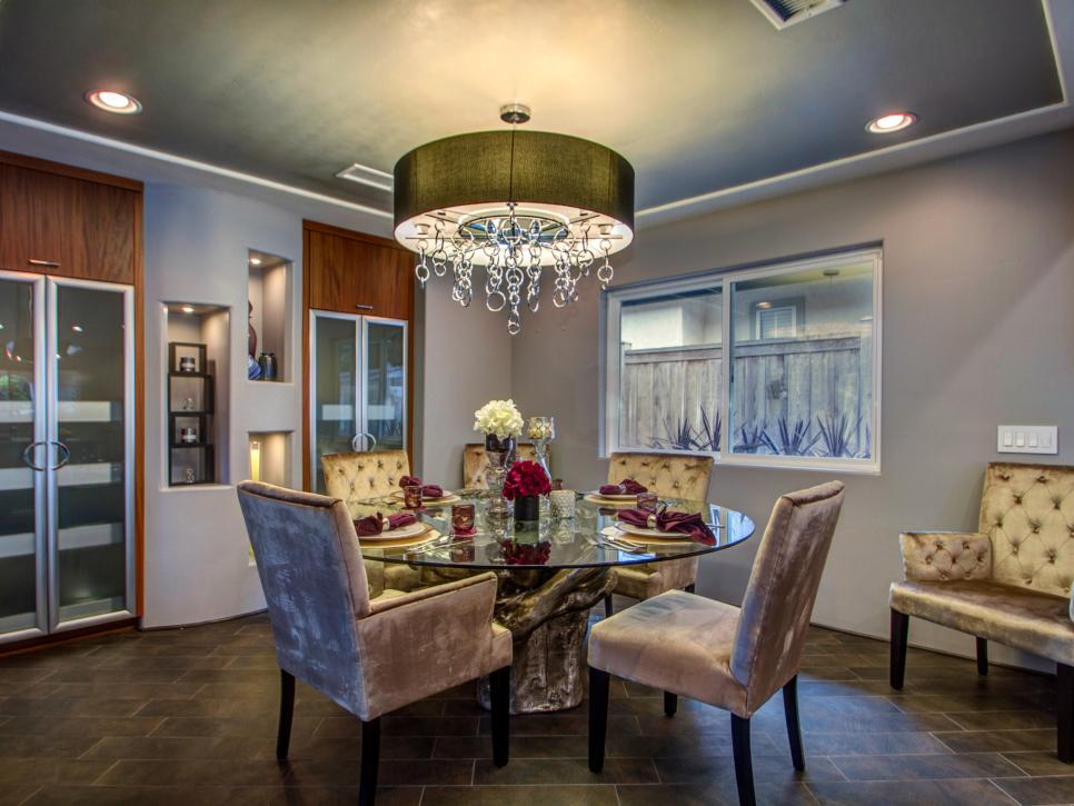 Contemporary Dining Room With Velvet Chairs and Chandelier