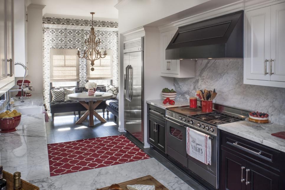 Gourmet Kitchen With Marble Accents and a Red Rug 