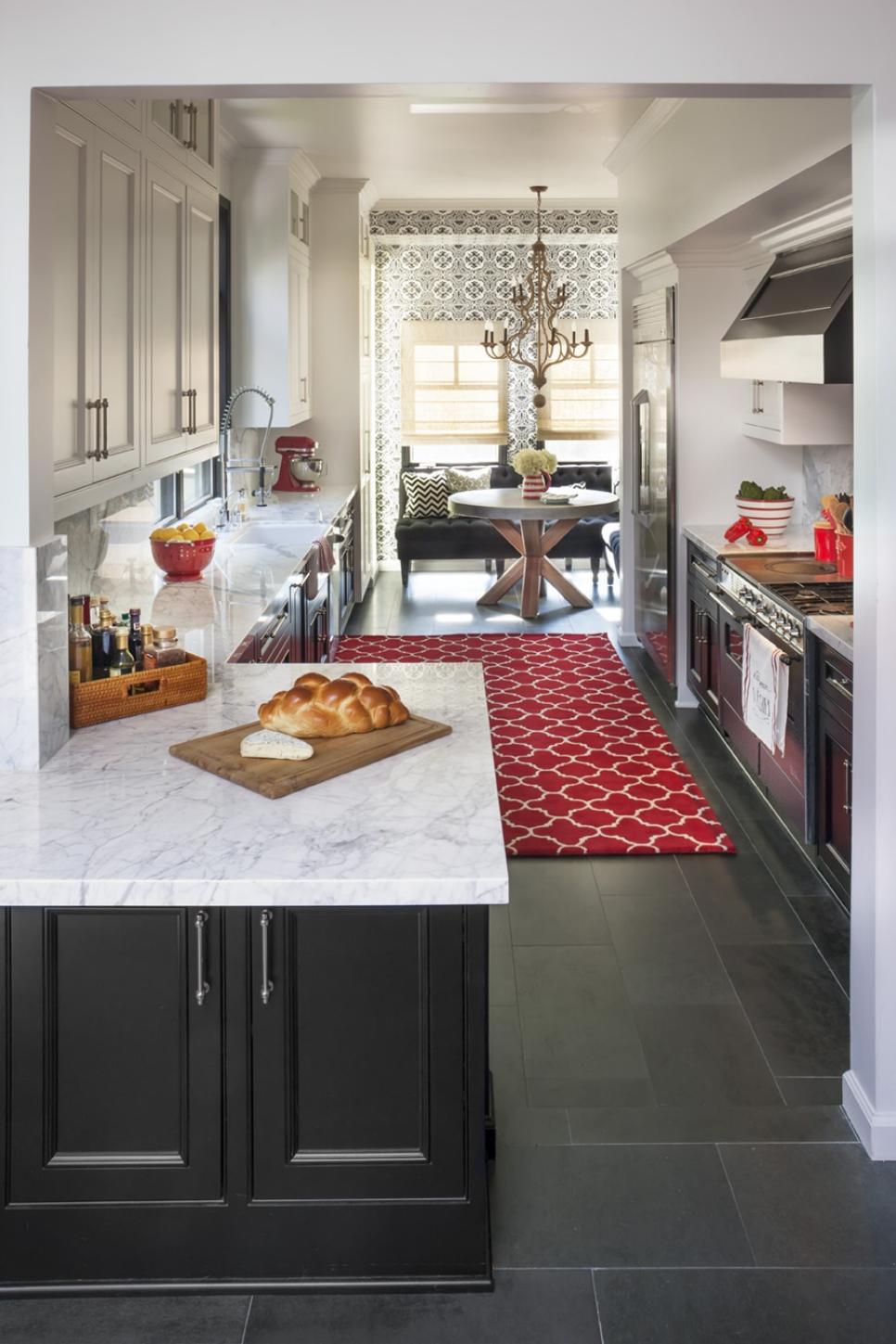 White Kitchen With White Cabinets, White Counters and Black Tile Floor