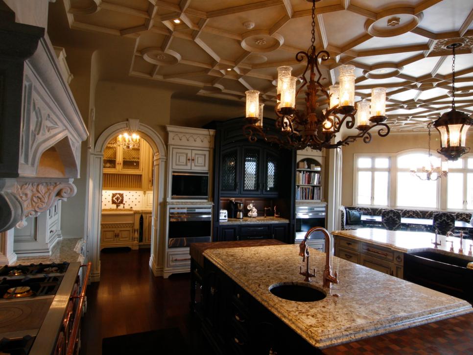 Neutral Kitchen With Ornate Ceiling Molding, Arched Door, Dark Island