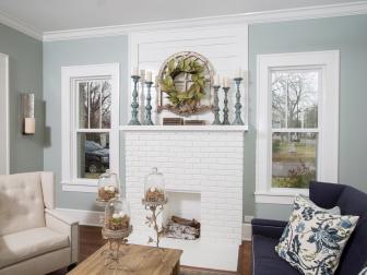 Light Blue Family Room With White Molding, Fireplace and Mantel
