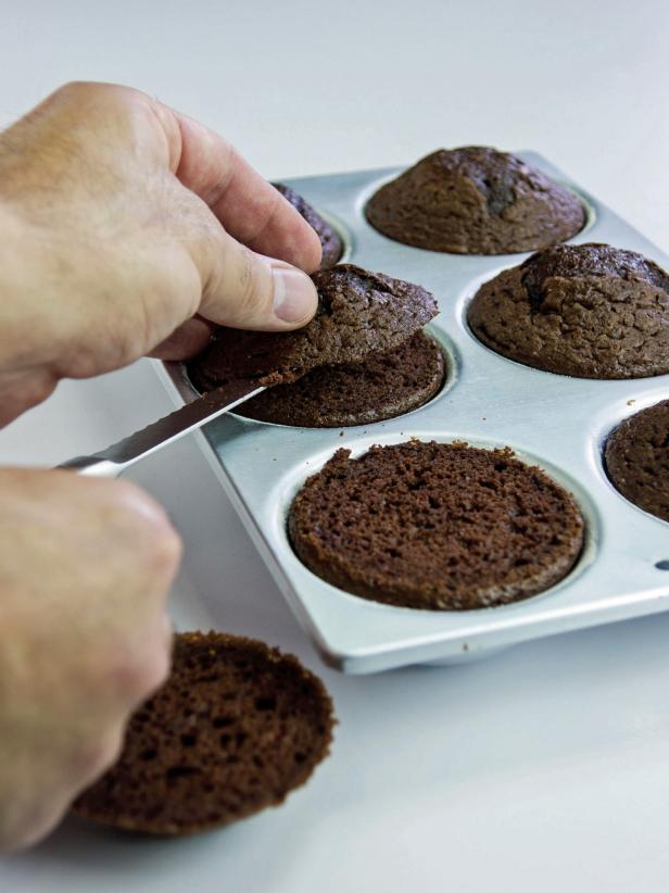 Allow Cakes to cool, Cut off Tops with serrated knife.