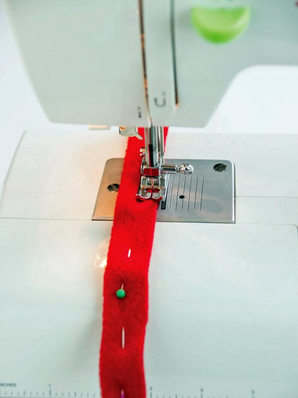 Fold them in hald lengthwise, pin, and sew them to create a strap.